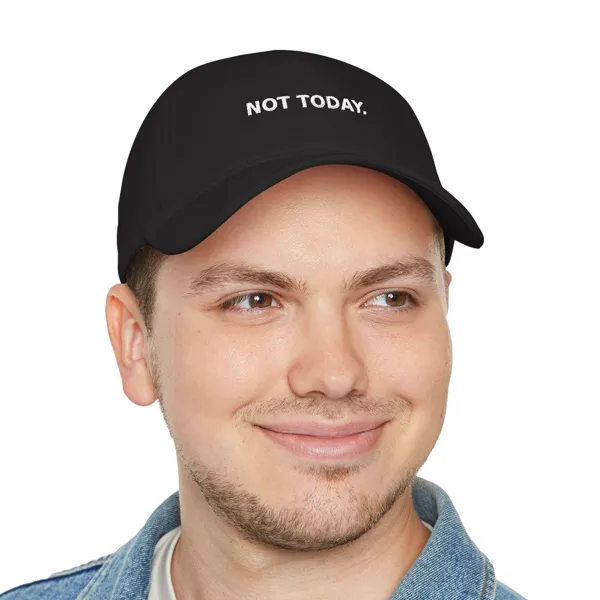 Man wearing a black cap with “NOT TODAY.” across the front